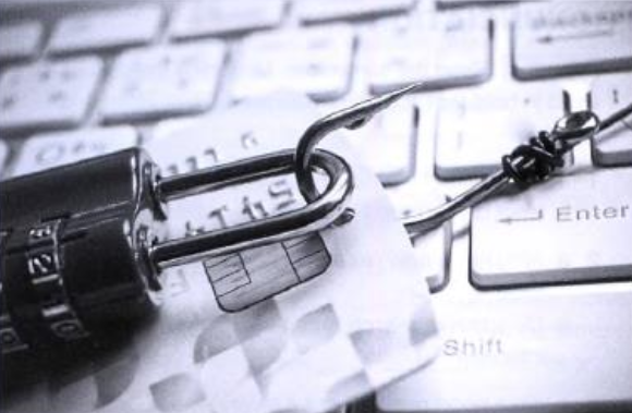 Image representing the personal information security. A Credit card attached to a lock laying on a keyboard. 